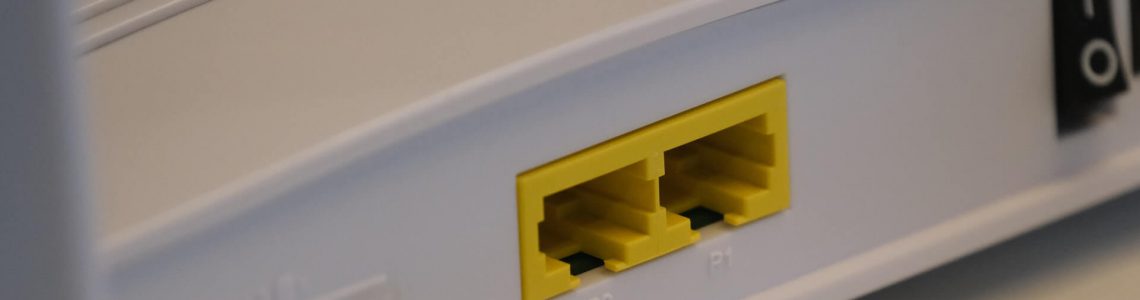 White router with yellow RJ45 port