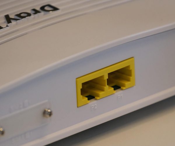 White router with yellow RJ45 port