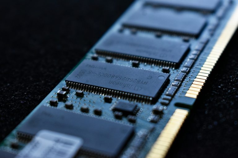 Close-up of a DDR memory module showing its gold-plated edge contacts